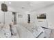 Serene bedroom featuring a sliding barn door, modern decor, and comfortable bedding at 5500 W Lake Butler Rd, Windermere, FL 34786