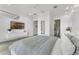 A main bedroom is bright with TV, ensuite bath and sliding door closet at 5500 W Lake Butler Rd, Windermere, FL 34786