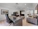 Modern home office with a glass desk, contemporary decor, and an adjacent half-bathroom at 5500 W Lake Butler Rd, Windermere, FL 34786