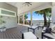 A covered patio with seating offers expansive water views at 5500 W Lake Butler Rd, Windermere, FL 34786