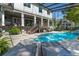 Beautiful pool area with a pool, lounge chairs, and lush landscaping, perfect for relaxing and enjoying the sun at 5500 W Lake Butler Rd, Windermere, FL 34786