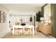 Bright, open-concept living space with dining area and kitchen, designed for modern living and entertaining at 7314 Ivy Tendril Ave, Orlando, FL 32829