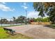 Community basketball court with benches, alongside other amenities, providing a space for recreational activities at 7759 Sugar Bend Dr # 7759, Orlando, FL 32819