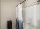 Clean bathroom featuring a white tiled shower and a modern shower curtain at 7759 Sugar Bend Dr # 7759, Orlando, FL 32819
