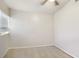 Empty bedroom with tiled floor, ceiling fan, and natural light from the window at 7759 Sugar Bend Dr # 7759, Orlando, FL 32819