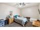 Comfortable bedroom featuring a ceiling fan, side tables, and ample natural light at 7759 Sugar Bend Dr # 7759, Orlando, FL 32819