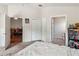 Bright bedroom with multiple doorways leading to other rooms, closet, and a neutral palette at 7759 Sugar Bend Dr # 7759, Orlando, FL 32819