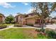 Charming two-story home with manicured landscaping, a small patio, and a private entryway at 7759 Sugar Bend Dr # 7759, Orlando, FL 32819
