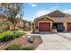 Charming townhome featuring a single-car garage, nicely landscaped yard, and warm color palette at 7759 Sugar Bend Dr # 7759, Orlando, FL 32819