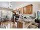 Charming kitchen featuring granite countertops, stainless steel appliances, and bright breakfast nook at 7759 Sugar Bend Dr # 7759, Orlando, FL 32819
