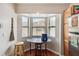 Breakfast nook with a bay window and table, adjacent to the kitchen featuring wood cabinets at 7759 Sugar Bend Dr # 7759, Orlando, FL 32819