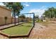 Community playground featuring swings and slides with safety features, set in a landscaped common area at 7759 Sugar Bend Dr # 7759, Orlando, FL 32819