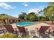 Relaxing community pool with lounge chairs for residents to enjoy the sunny Florida weather at 7759 Sugar Bend Dr # 7759, Orlando, FL 32819