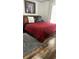 Comfortable bedroom with hardwood floors, a large bed, and a grey rug at 1030 Marcello Blvd, Kissimmee, FL 34746
