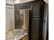 View of the kitchen featuring a stainless steel refrigerator and granite countertops at 1030 Marcello Blvd, Kissimmee, FL 34746