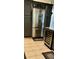 Modern kitchen featuring stainless steel refrigerator and dark wood cabinetry at 1030 Marcello Blvd, Kissimmee, FL 34746
