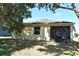 Back of house showing screened patio and view of backyard at 1886 Van Gogh Dr, Auburndale, FL 33823