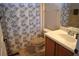 Clean, neutral bathroom with a single sink vanity, tile flooring, and a shower-tub combo at 1886 Van Gogh Dr, Auburndale, FL 33823