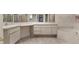 Bathroom with double sink vanity, large mirrors, and a luxurious corner soaking tub at 5060 Se 40Th St, Ocala, FL 34480