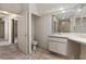 Bathroom featuring tile floors, extended vanity area, and separate water closet at 5060 Se 40Th St, Ocala, FL 34480