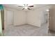 Open bedroom with ceiling fan and neutral tones, offering a versatile living space at 5060 Se 40Th St, Ocala, FL 34480
