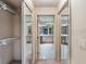 Spacious walk-in closet with mirrored doors offers ample storage and organization solutions at 5060 Se 40Th St, Ocala, FL 34480