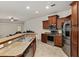 Open-concept kitchen with stainless steel appliances and abundant counter space at 5060 Se 40Th St, Ocala, FL 34480
