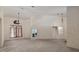Bright and airy living room with large windows and chandelier creating a spacious atmosphere at 5060 Se 40Th St, Ocala, FL 34480
