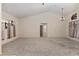 Large living room with high ceilings, ample natural light, and elegant light fixtures at 5060 Se 40Th St, Ocala, FL 34480