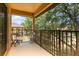 View from a balcony showing two chairs and lush trees at 140 Napoli Dr, Davenport, FL 33897