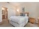 Comfortable bedroom with carpet, a full bed, and a mirrored closet at 140 Napoli Dr, Davenport, FL 33897