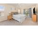 Bedroom with a ceiling fan, natural light, and a private balcony access at 140 Napoli Dr, Davenport, FL 33897