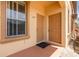 Front porch with two entry doors and a window at 140 Napoli Dr, Davenport, FL 33897