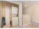 Laundry area with a stacked washer and dryer unit, plus extra storage space at 140 Napoli Dr, Davenport, FL 33897