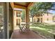 Exterior patio area with seating and a grassy lawn at 140 Napoli Dr, Davenport, FL 33897