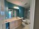 Bathroom offers a marble-look tiled shower and modern light fixture at 2300 N Atlantic Ave # 1502, Daytona Beach, FL 32118