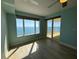 This primary bedroom has ocean views, and a door to the balcony at 2300 N Atlantic Ave # 1502, Daytona Beach, FL 32118