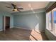 Light-filled bedroom showcasing ocean views, fan and a walk-in closet at 2300 N Atlantic Ave # 1502, Daytona Beach, FL 32118