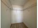 Walk-in closet featuring metal shelving for simple storage at 2300 N Atlantic Ave # 1502, Daytona Beach, FL 32118