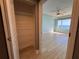 Walk-in closet with metal shelving for optimal storage solutions at 2300 N Atlantic Ave # 1502, Daytona Beach, FL 32118