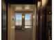 Well-lit elevator foyer with large windows that show the surrounding town and blue skies at 2300 N Atlantic Ave # 1502, Daytona Beach, FL 32118