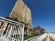 A multi-story building with views of the ocean and a well-manicured lawn at 2300 N Atlantic Ave # 1502, Daytona Beach, FL 32118