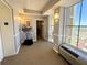 Hallway featuring modern art and lighting, with glimpses of a view through the windows at 2300 N Atlantic Ave # 1502, Daytona Beach, FL 32118