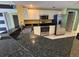 Kitchen boasts stainless steel appliances and dark countertops at 2300 N Atlantic Ave # 1502, Daytona Beach, FL 32118