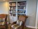 Cozy library with built-in bookcase and two comfortable wicker chairs at 2300 N Atlantic Ave # 1502, Daytona Beach, FL 32118