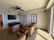 Comfortable lounge area with four chairs, a table, television, and ceiling fan at 2300 N Atlantic Ave # 1502, Daytona Beach, FL 32118