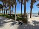 Outdoor shower area with palm trees, beach access, and ocean views at 2300 N Atlantic Ave # 1502, Daytona Beach, FL 32118