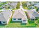 View of backyard featuring a well-maintained lawn, complemented by a small covered patio at 518 Cortez Dr, Davenport, FL 33837