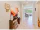Bright entryway with tile floors, decorative table, and a view into the living area at 518 Cortez Dr, Davenport, FL 33837