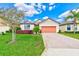 Charming single-story home with a well-manicured lawn and inviting curb appeal at 518 Cortez Dr, Davenport, FL 33837